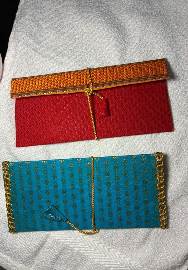 Images shows 2 handmade gifting envelopes.