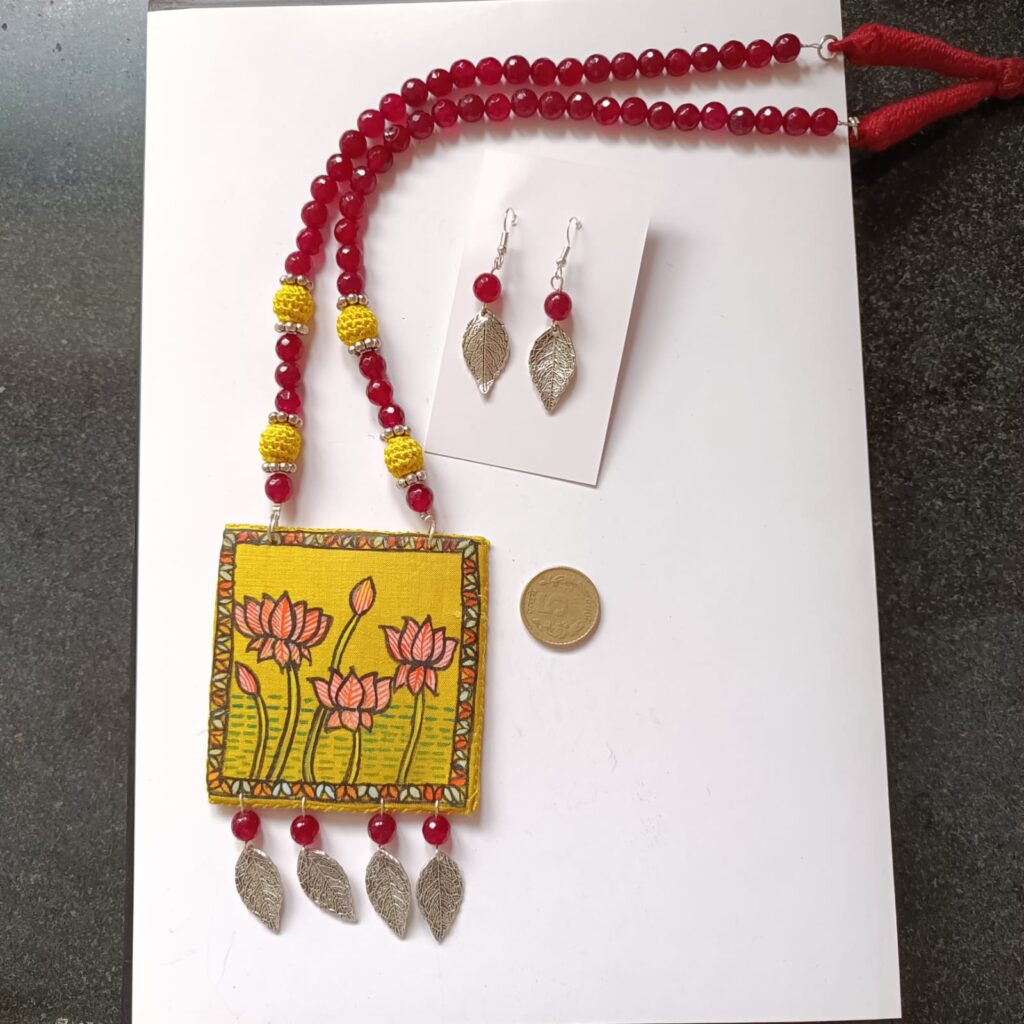 Image of a set of necklace with handpainted wooden pendant and earrings
