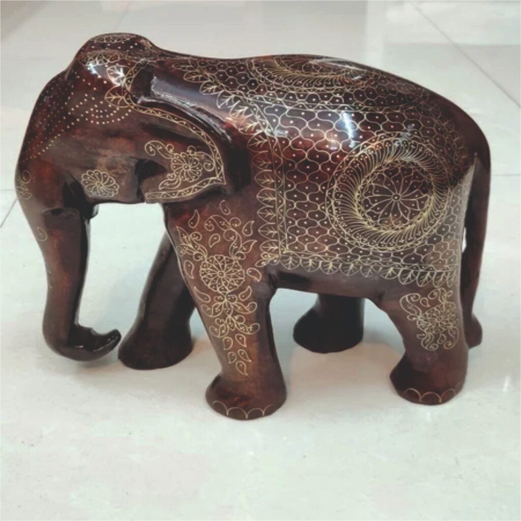 Image shows a decorative brass elephant