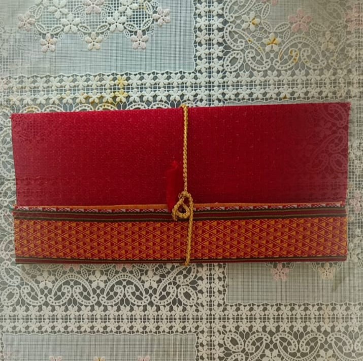 Image shows a handcrafted Gift Envelope from cloth - red colour