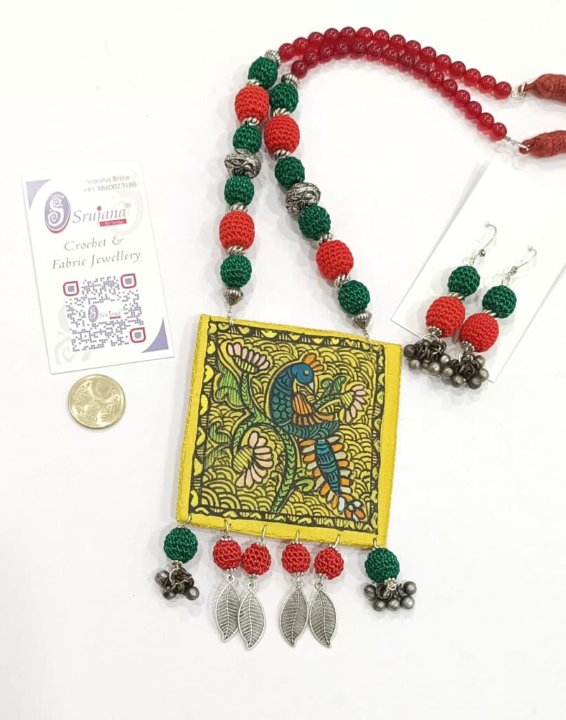 Image shows Handmade Metal and crochet necklace set with handpainted cloth pendant