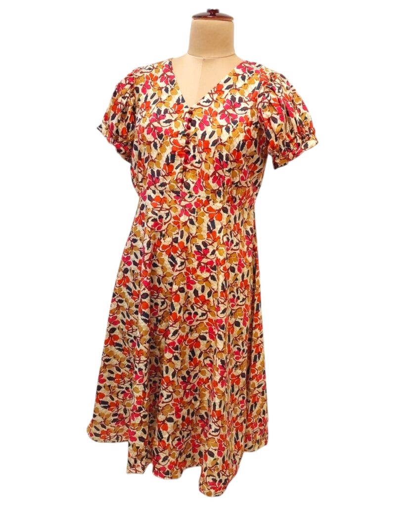 Image shows a PUFFED SLEEVES V NECK FLORAL MAXI DRESS