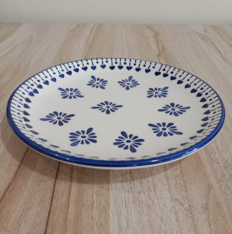 Image shows a blue pottery serving plate