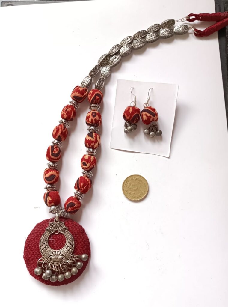 Image shows a handmade full set with metal, cloth beads and oxidised pendant