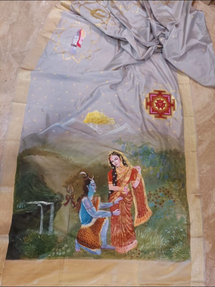 Image shows a hand-painted mythological saree showing lord Shiva & Parvati