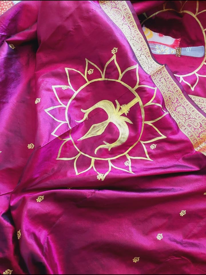 Image shows hand-painted wearable art saree in dark pink colour.
