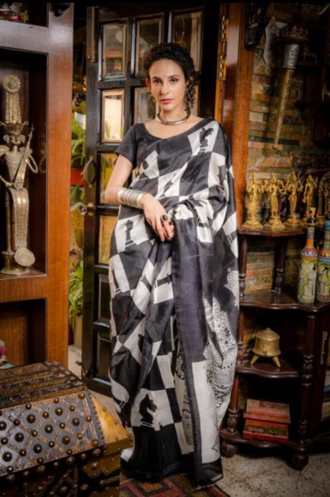 Image shows hand-painted wearable art saree in black colour.